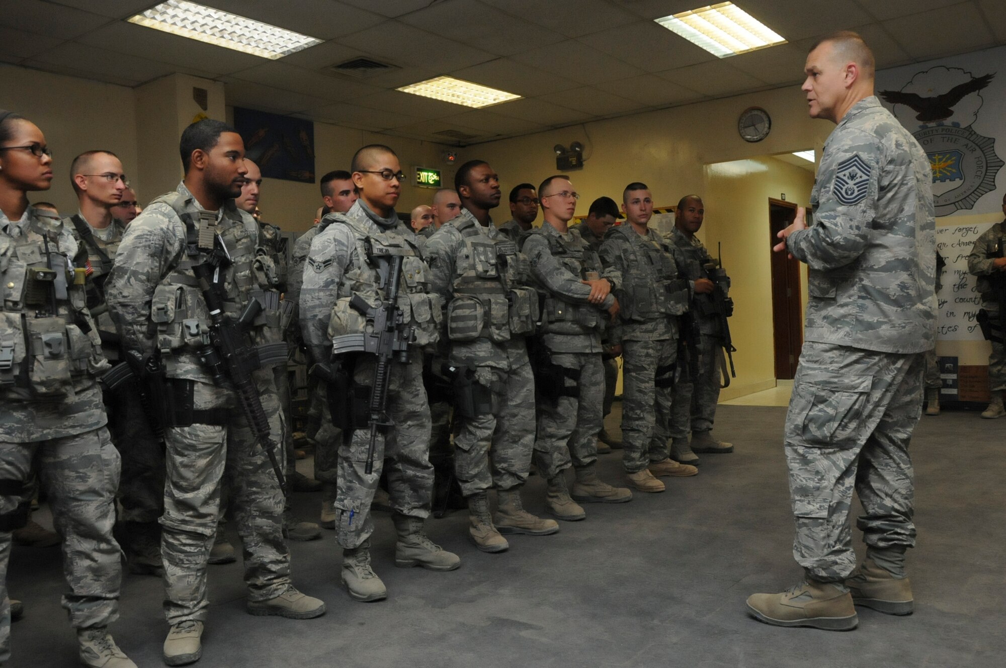 Chief Master Sgt. of the Air Force James Roy visits with members of the 386th Expeditionary Security Forces Squadron at an undisclosed location in Southwest Asia, May 21, 2012. Roy was visiting with the deployed Airmen to discuss issues, challenges, and concerns that are currently facing the United States Air Force and its personnel. (U.S. Air Force photo by Staff Sgt. James Lieth/Released)