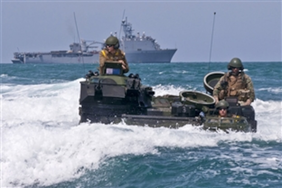 U.S. Marines drive their amphibious assault vehicle toward Hat Yao Beach for a Thai and U.S. Navy beach landing in the Gulf of Thailand, May 23, 2012. The U.S. Marines, assigned to the 4th Marine Regiment, are embarked aboard the amphibious dock landing ship USS Germantown, rear, and are participating in Cooperation Afloat Readiness and Training Thailand 2012. The annual exercises in Southeast Asia strengthen relationships and enhance force readiness. 