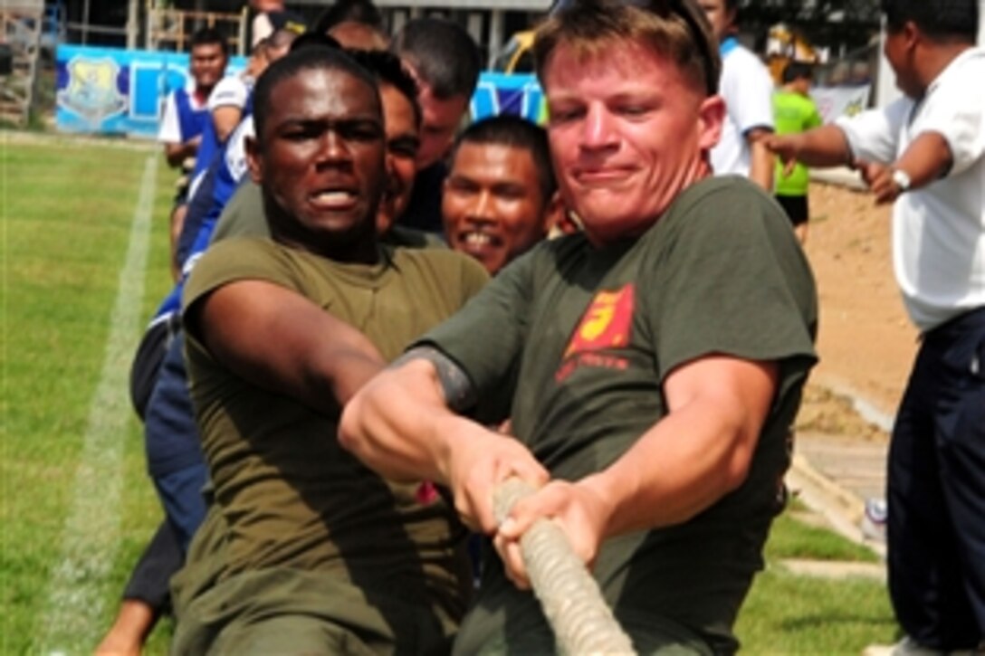 Royal Thai Armed Forces and U.S. service members enjoy a game of tug-o-war during a joint sports day event in Pattaya, Thailand, May 24, 2012, during Cooperation Afloat Readiness and Training Thailand 2012. CARAT is a series of bilateral exercises held annually in Southeast Asia to strengthen relationships and enhance force readiness.