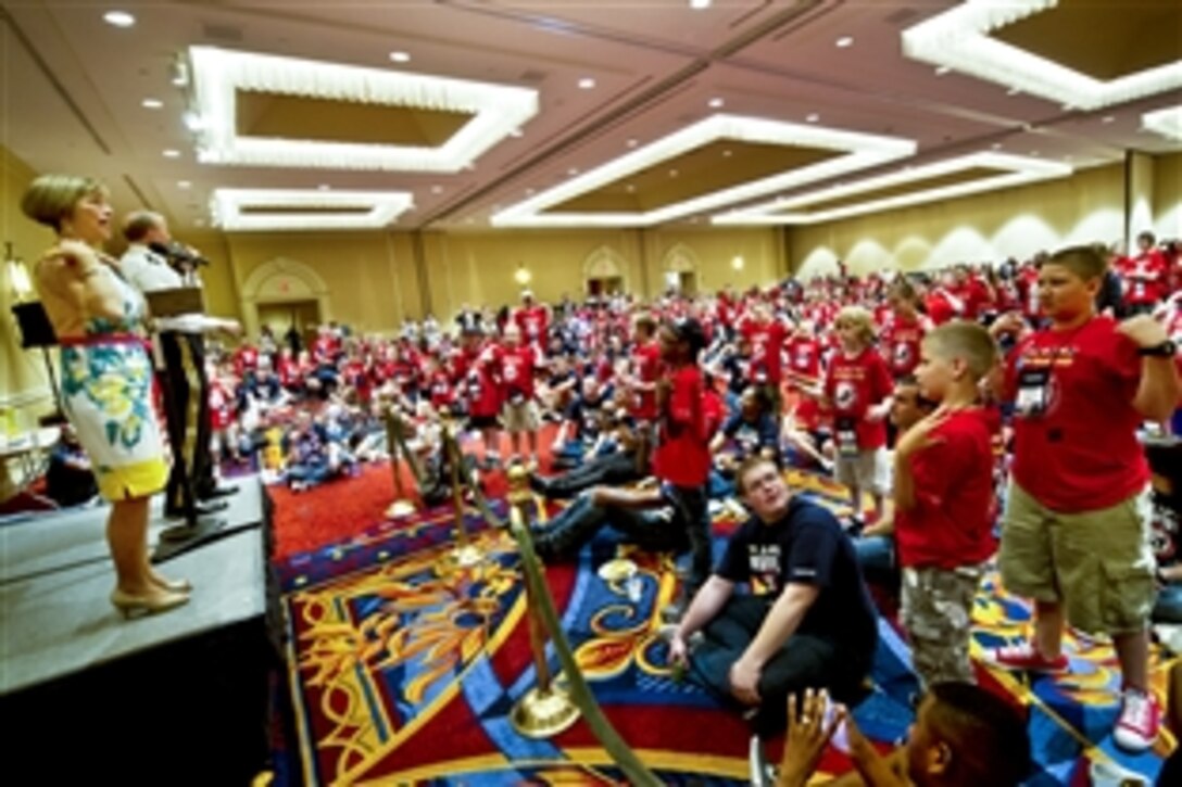 Army Gen. Martin E. Dempsey, chairman of the Joint Chiefs of Staff, and his wife, Deanie, interact with children at the 18th annual TAPS National Military Survivor Seminar and Good Grief Camp in Arlington, Va., May 25, 2012. TAPS, or Tragedy Assistance Program for Survivors, is a nonprofit group that supports surviving families of fallen service members.