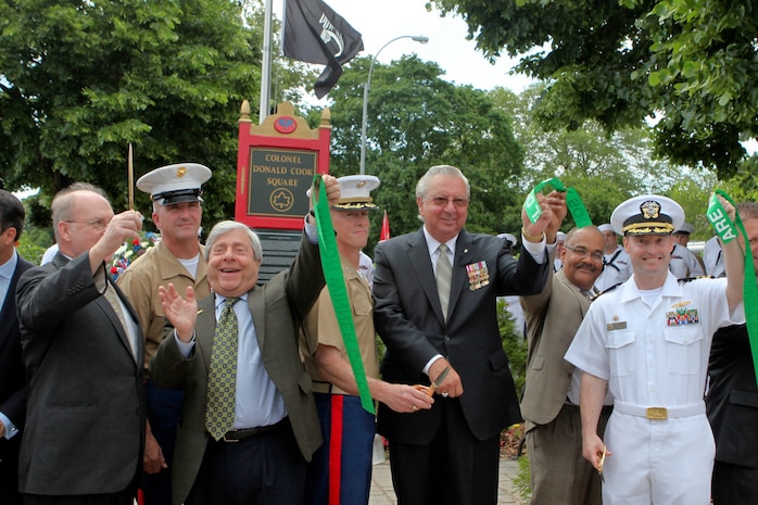 Col. Kenneth M. DeTreux (center), commanding officer, Special Purpose Marine-Air Ground Task Force - New York, and other civic leaders rededicated the Col. Donald Cook Park in Brooklyn, New York, May 24. Cook joined the Marine Corps in 1957. During the Vietnam War, Cook volunteered to lead a nine-manned reconnaissance mission to search for a downed helicopter. Cook was shot and captured during this mission. Throughout his time as a prisoner of war, Cook refused to give information to his captors regarding the U.S. military. For this, he was given less food and often placed in solitary confinement. Even under such conditions, Cook gave most of his food away to other prisoners who he felt were in more need. He was posthumously awarded the Medal of Honor. Cook remains the only Marine to be awarded the Medal of Honor while he was a POW. Fleet Week is an opportunity for Marines, sailors, and coast guardsmen to show the people of New York what the Navy, Marine and Coast Guard team is, what they do, and how committed it is to serving this country. Twenty-one U.S. and coalition ships and more than 6,000 troops will participate in the 25th anniversary of Fleet Week New York, a celebration of the Bicentennial of the War of 1812, May 23-30. (Official Marine Corps photo by Cpl. Martin Egnash)