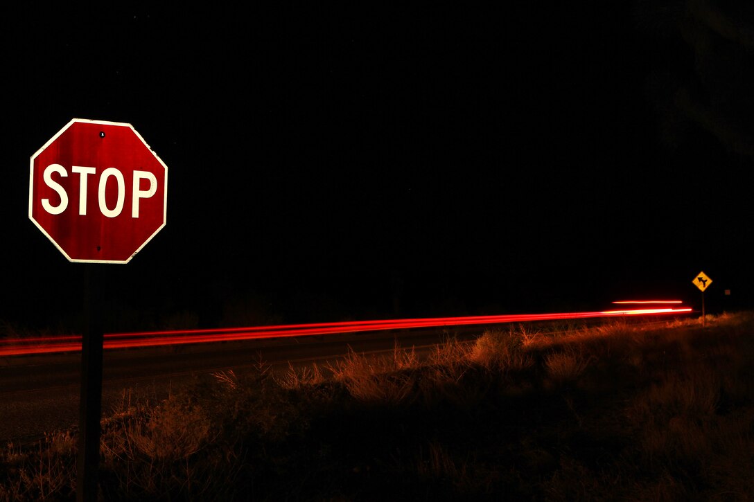This photo took some time to get right, and it took about eight drive-bys at 1 a.m. My boss, GySgt. Leo Salinas, dropped me off near the stop sign, and took off in his Jeep so I could do a few practice shots to get it looking just right. I stood there alone in the middle of the desert with no protection and thousands of dollars of camera gear. I started to feel uneasy. I had this image in my head of a wanderer with an eye patch and a beard creeping up next to me as I pop my flash for the shot. No kidding, like a bad 80s horror movie. I stood there for sometime conjuring this wild story for no reason at all. When my gunny stopped, I noticed lights in the distance rushing toward us. I didn't find out who or what those lights were because I insisted we just take off. Don't judge me. I never like scary movies.