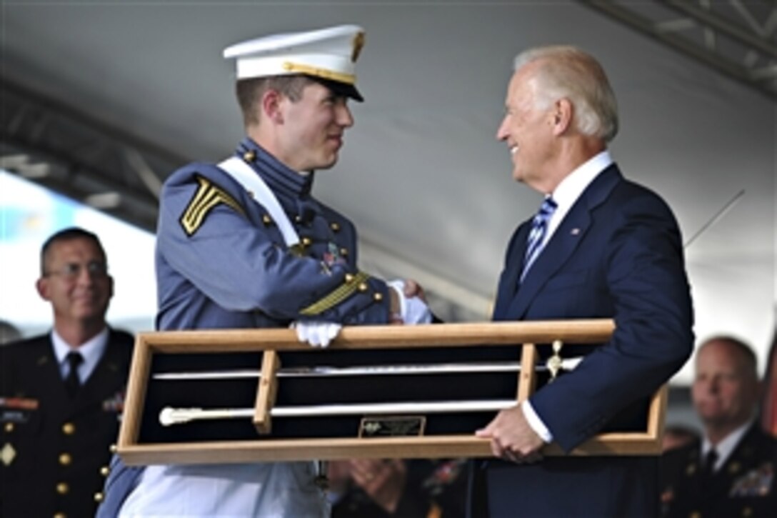 Vice President Joe Biden receives the West Point Cadets' Sword from cadet Maxwell Love as a token of appreciation from the class of 2012 during its commencement exercises at the U.S. Military Academy at West Point, N.Y., May 26, 2012. Biden was the keynote speaker. 