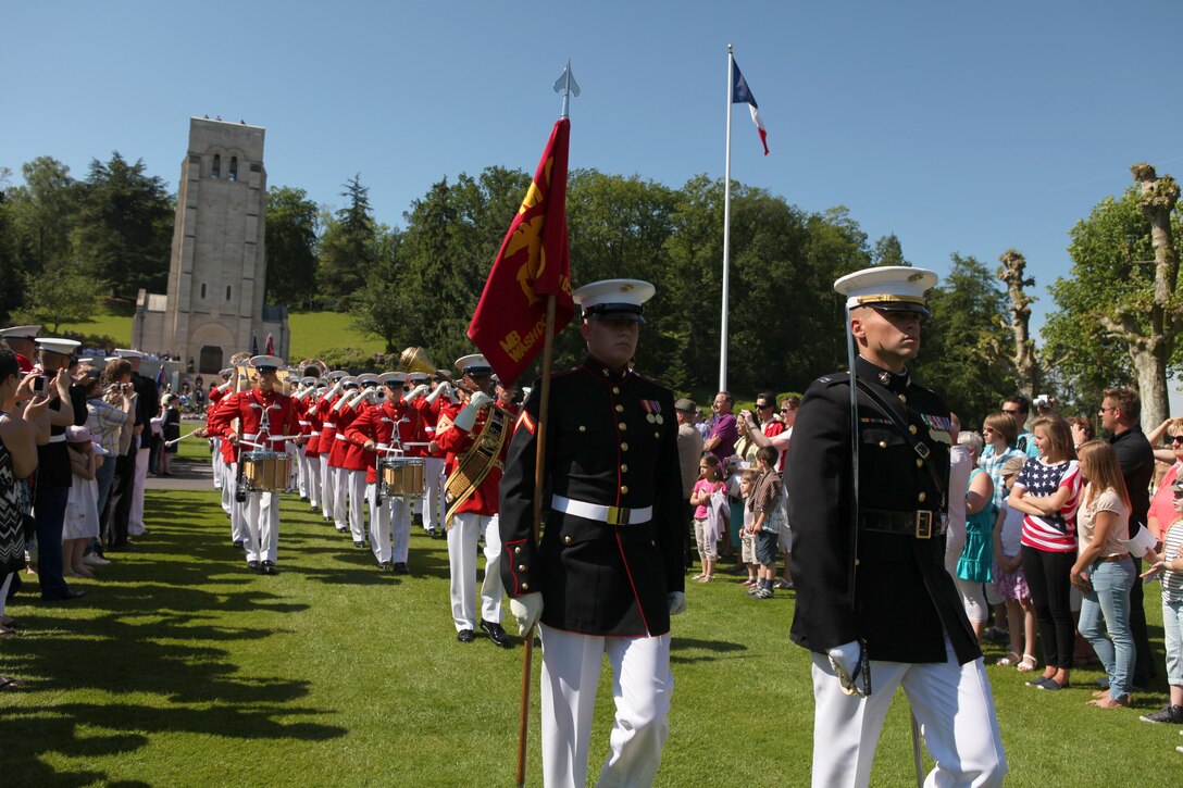 Capt. Edward Hubbard, the ceremony commander, right, and Pfc. Clayton Caley, a ceremonial guidon bearer, lead the Battle Color Detachment off the parade deck during a Memorial Day commemoration ceremony to pay tribute to the American and French lives lost during the Battle of Belleau Wood at Aisne-Marne American Memorial Cemetery, May 27. The BCD, composed of the Marine Corps S...ilent Drill Platoon, Marine Drum & Bugle Corps, official Marine Corps Color Guard and a ceremonial firing squad, participated in the event and all are Marine Barracks Washington-based. The ceremony marked the 94th anniversary of the battle and represented the long-lasting American-French friendship, brotherhood forged before the battle grounds of World War I to the current operations in Afghanistan. The cemetery has 2,039 known-buried, and 250 unidentified, who lay in the slopes of the hill. In the chapel, more than a 1,000 are inscribed in remembrance of the missing.