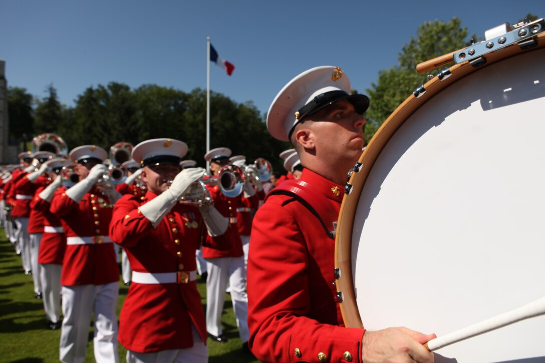 The U.S. Marine Drum & Bugle Corps marches off the parade deck during a Memorial Day commemoration ceremony to pay tribute to the American and French lives lost during the Battle of Belleau Wood at Aisne-Marne American Memorial Cemetery, May 27. The Battle Color Detachment, composed of theD&B, Marine Corps Silent Drill Platoon, official Marine Corps Color Guard and a ceremon...ial firing squad, participated in the event and all are Marine Barracks Washington-based. The ceremony marked the 94th anniversary of the battle and represented the long-lasting American-French friendship, brotherhood forged before the battle grounds of World War I to the current operations in Afghanistan. The cemetery has 2,039 known-buried, and 250 unidentified, who lay in the slopes of the hill. In the chapel, more than a 1,000 are inscribed in remembrance of the missing.