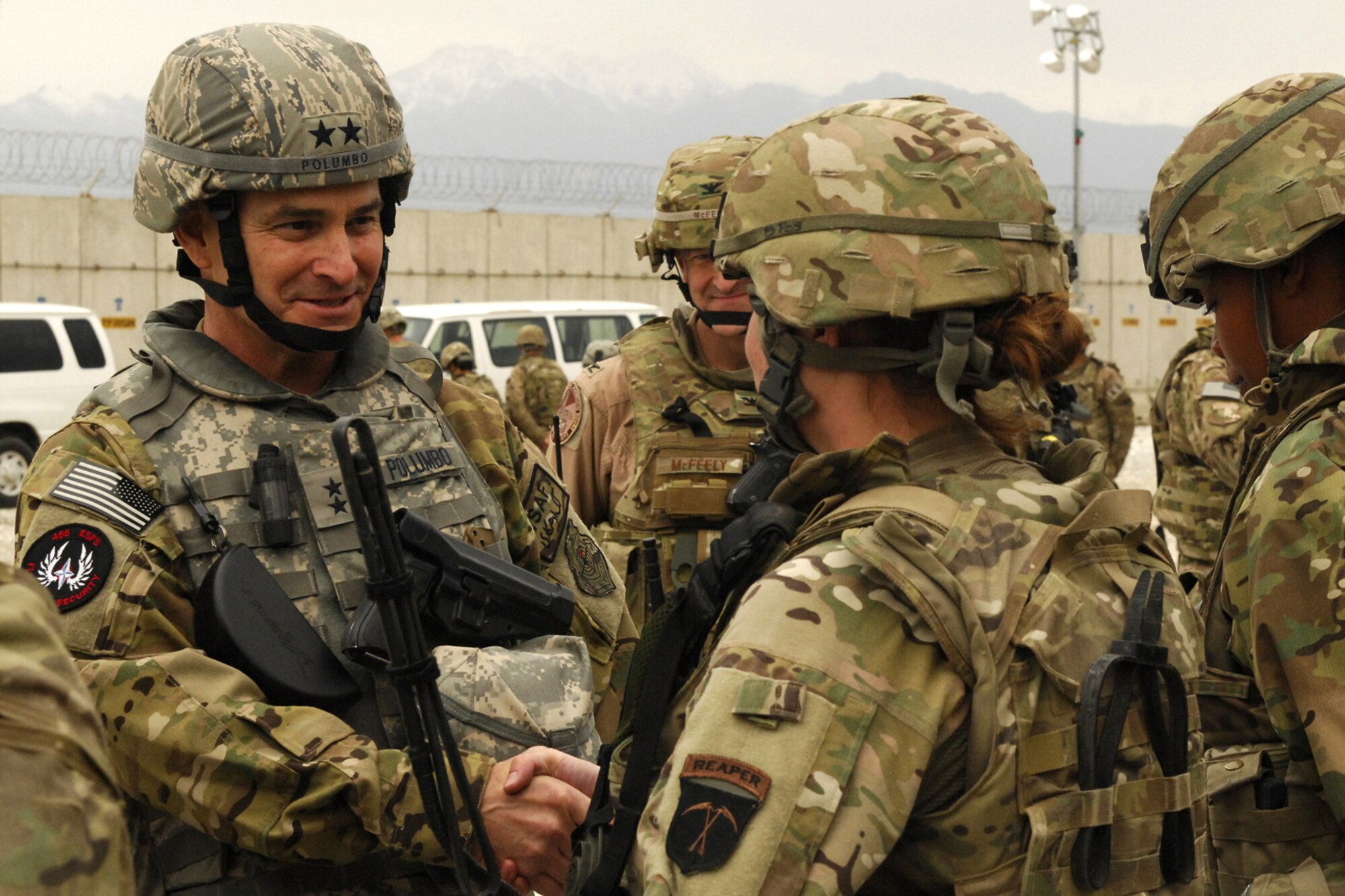 Maj. Gen. H. D. Polumbo, 9th Air Expeditionary Task Force-Afghanistan commander, visits with members of the 455th Expeditionary Security Forces Squadron at Bagram Airfield, Afghanistan, May 25, 2012. Polumbo asked the Airmen of the 455 ESFS about their home towns and the Airmen discussed their duties and responsibilities in keeping the base and its personnel secure. (U.S. Air Force photo/Staff Sgt. Jeff Nevison)