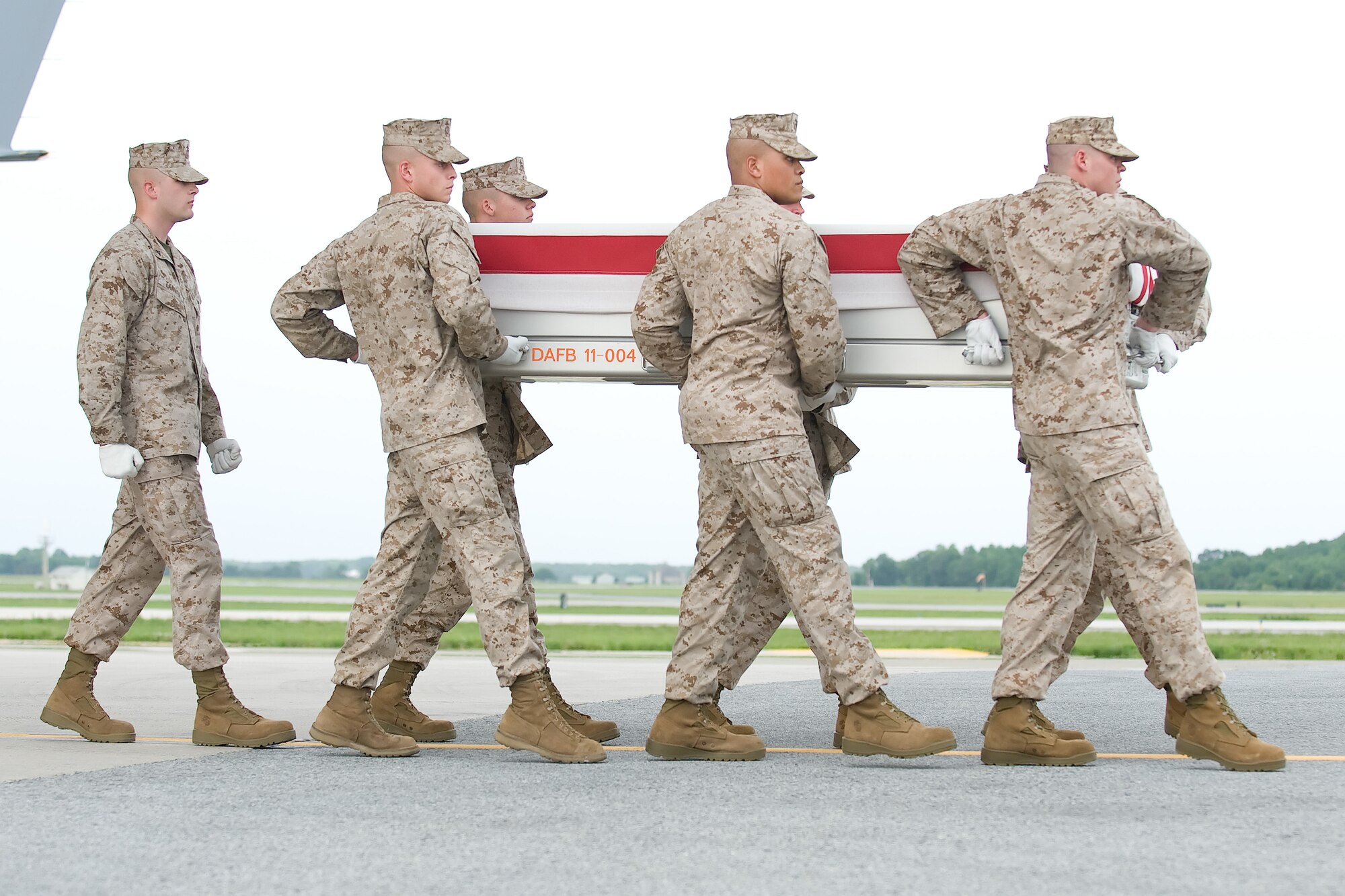 A U.S. Marine Corps carry team transfers the remains of Marine Cpl. Keaton G. Coffey of Boring, Ore., at Dover Air Force Base, Del., May 26, 2012. Coffey was assigned to 1st Law Enforcement Battalion, 1st Marine Headquarters Group, 1st Marine Expeditionary Force, Camp Pendleton, Calif. (U.S. Air Force photo/Adrian R. Rowan)
