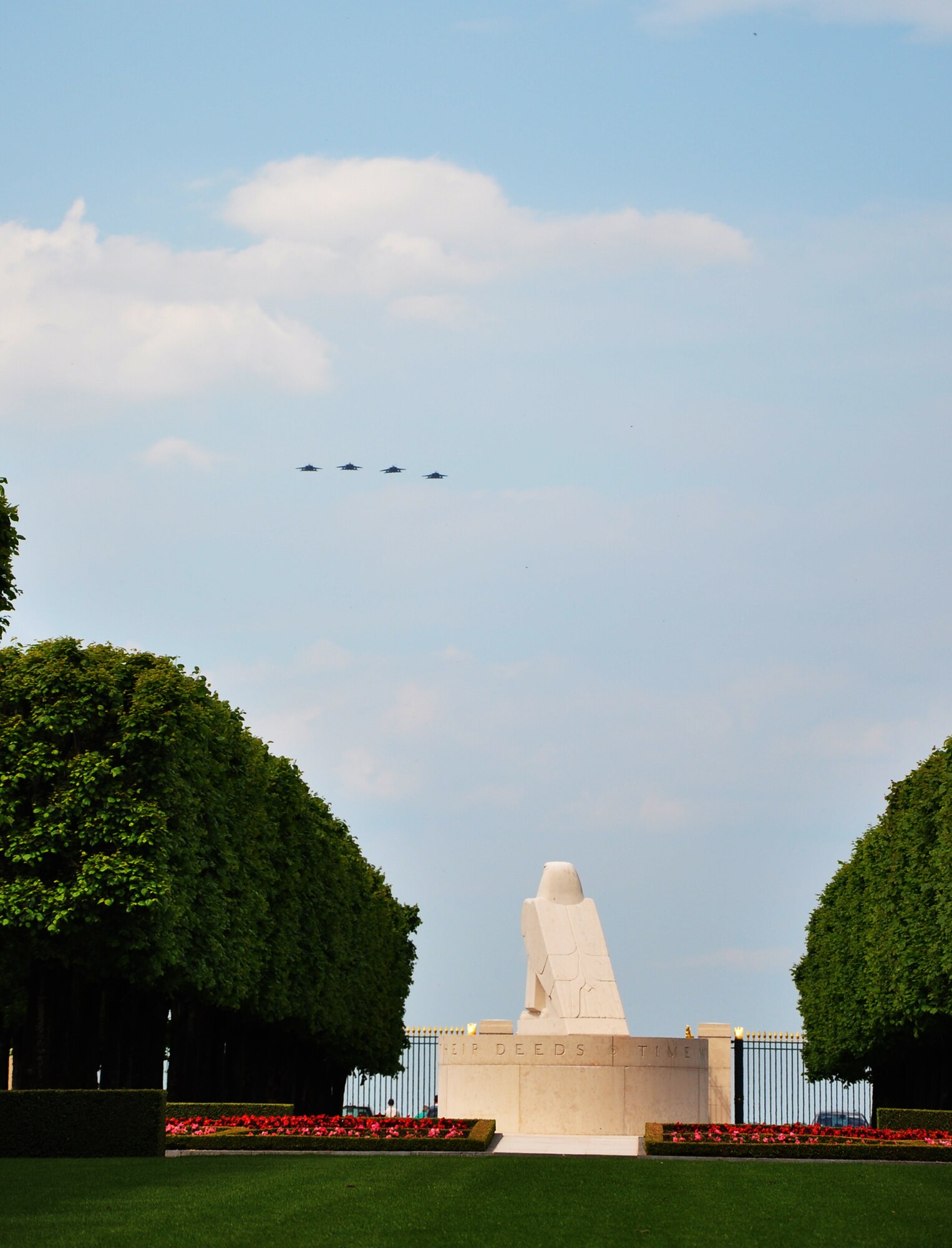 THIAUCOURT, France -- F-15E Strike Eagles from the 494th Fighter Squadron, Royal Air Force Lakenheath, United Kingdom, fly in formation over the annual Memorial Day event at the St. Mihiel American Cemetery May 27, 2012. U.S. Air Forces in Europe Airmen and other locals participated in the ceremony at the 40.5-acre World War I cemetery, about 24 miles southwest of Metz, France. The cemetery contains the graves of 4,153 of U.S. military dead. It is the third largest of the eight World War I American military cemetery memorials in Europe. (U.S. Air Force photo by Tech. Sgt. Francesca Popp)