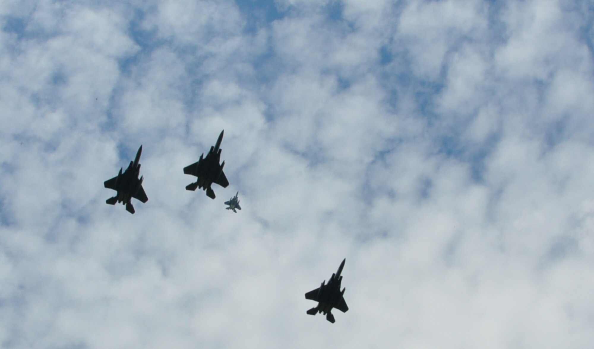 THIAUCOURT, France -- F-15E Strike Eagles from the 494th Fighter Squadron, Royal Air Force Lakenheath, United Kingdom, fly a missing man formation over the annual  Memorial Day event at the St. Mihiel American Cemetery May 27, 2012. U.S. Air Forces in Europe Airmen and other locals participated in the ceremony at the 40.5-acre World War I cemetery, about 24 miles southwest of Metz, France. The cemetery contains the graves of 4,153 of U.S. military dead. It is the third largest of the eight World War I American military cemetery memorials in Europe. (U.S. Air Force photo by Tech. Sgt. Francesca Popp)