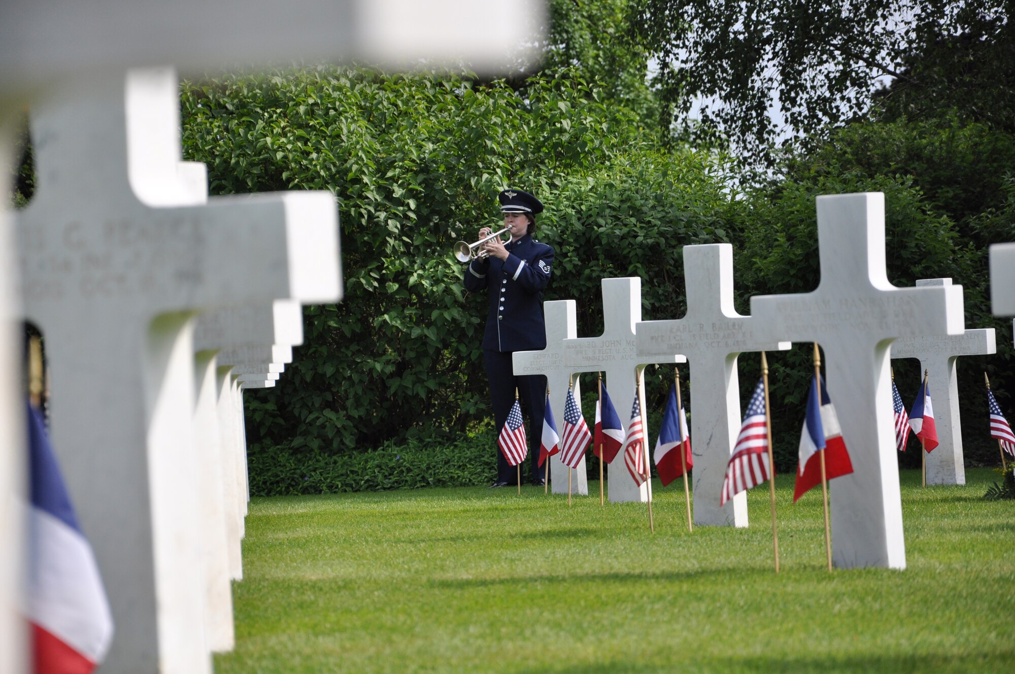 THIAUCOURT, France -- Staff Sgt. Laura Kluga, U.S. Air Forces Band in Europe, plays "Taps" at the Memorial Day event at the St. Mihiel American Cemetery May 27, 2012. The 40.5-acre World War I cemetery, about 24 miles southwest of Metz, France, contains the graves of 4,153 of U.S. military dead. It is the third largest of the eight World War I American military cemetery memorials in Europe. (U.S. Air Force photo by Tech. Sgt. Francesca Popp)
