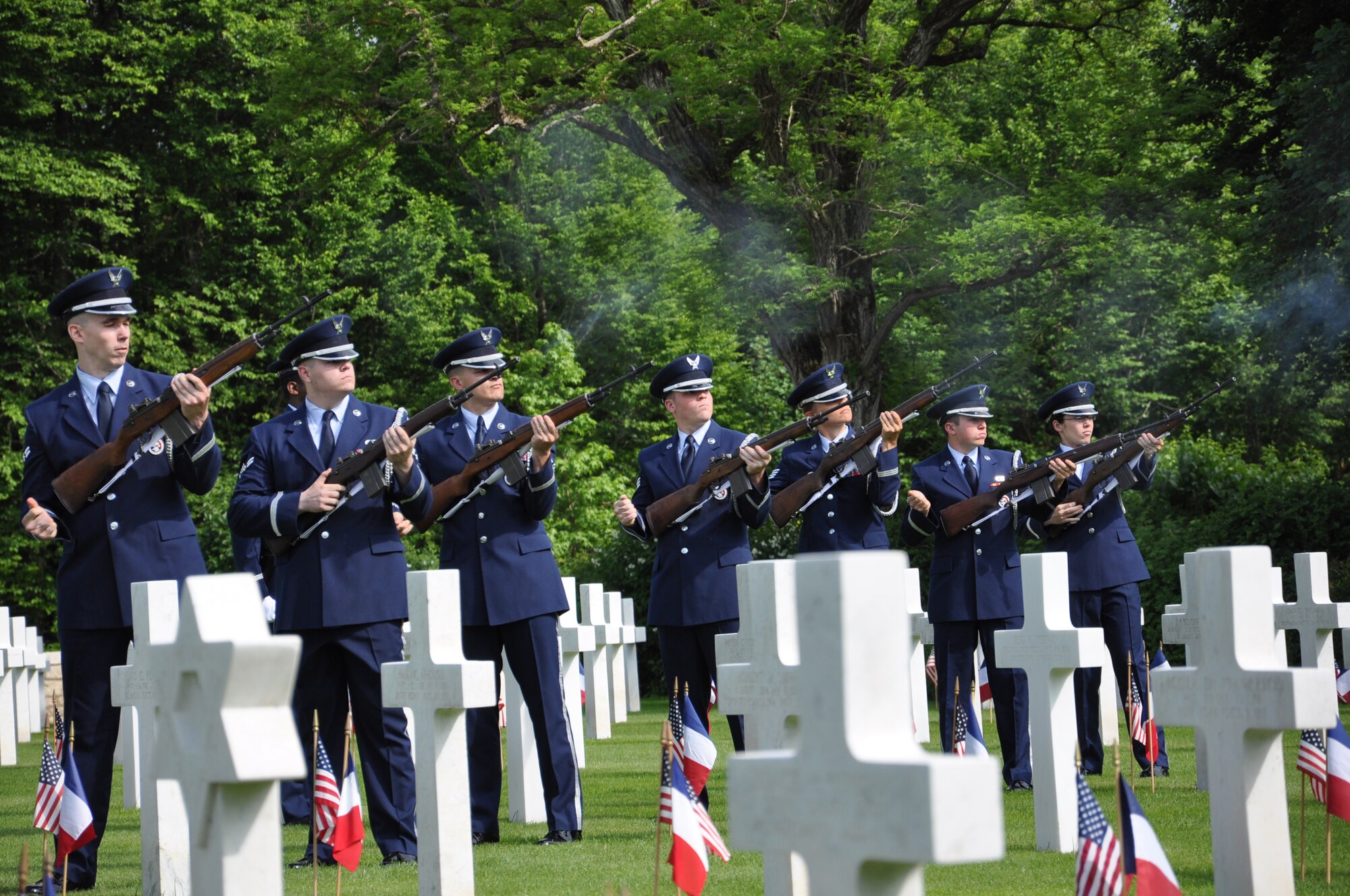 THIAUCOURT, France -- Members of the Ramstein Air Base, Germany, Honor Guard volley a 21-gun salute during the Memorial Day event at the St. Mihiel American Cemetery May 27, 2012. The 40.5-acre World War I cemetery, about 24 miles southwest of Metz, France, contains the graves of 4,153 of U.S. military dead. It is the third largest of the eight World War I American military cemetery memorials in Europe. (U.S. Air Force photo by Tech. Sgt. Francesca Popp)