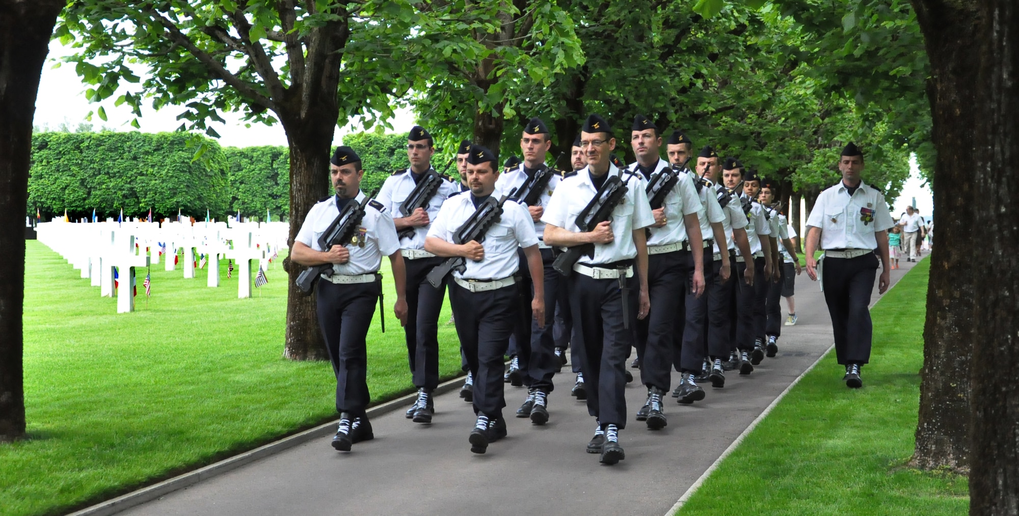 THIAUCOURT, France -- A squad from French Air Force's Air Base 133 "Henri Jeandet" march through St. Mihiel American Cemetery to take their position near the memorial. U.S. Air Forces in Europe Airmen and other locals participated in the annual Memorial Day Ceremony May 27, 2012 at the World War I cemetery about 23 miles southwest of Metz, France.  The 40.5-acre cemetery contains the graves of 4,153 of U.S. military dead, according to the cemetery's website. The majority of these died in the September 1918 offensive that resulted in the reduction of the St. Mihiel salient that threatened Paris. The St. Mihiel is the third largest of the eight World War I American military cemetery memorials in Europe. (U.S. Air Force photo by Tech. Sgt. Francesca Popp)