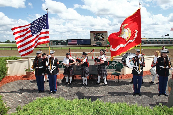 Pfc. Richard Reese, Sgt. Joshua Draveling, Sgt. Nicholas Bynum and Cpl. Timothy Anderson act as the color guard during the Canterbury Park Memorial Day ceremony May 28. Various veteran organizations were recognized at the event.