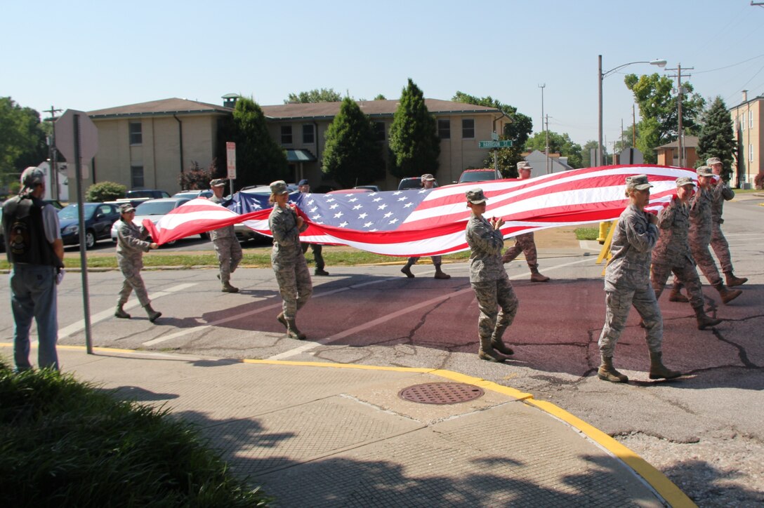 Amazing, dedicated, and patriotic Airmen of the 932nd Airlift Wing march the U.S. flag in the 2012 Belleville, Ill, annual Memorial Day Parade. Volunteers for this year's parade were given several standing ovations throughout the trip down main street in Illinois. (U.S. Air Force photo/Maj. Stan Paregien, 932nd AW Public Affairs)