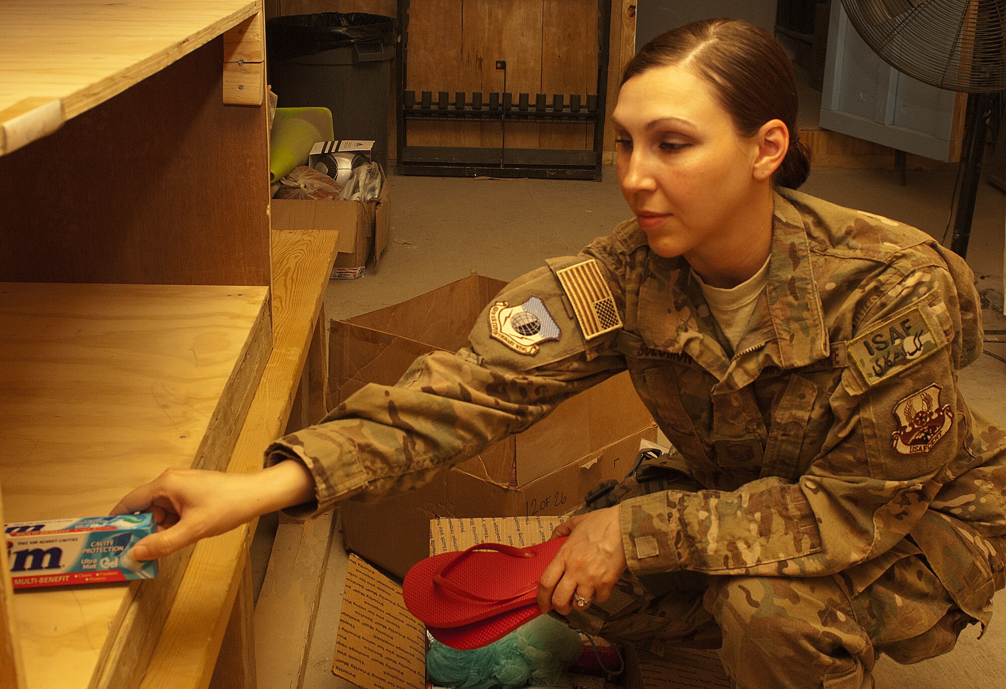Master Sgt. Chastity Solomon, Attic organizer, sets up for The Attic's grand
opening on Camp Cunningham in Bagram Airfield, Afghanistan, May 28, 2012.
The Attic is a morale center, attached to the back of the 5/6 Shack, that
will house donated items similar to those found in an Airman's Attic at Air
Force home stations. Solomon, a native of Clinchco, Va., will open The Attic
May 31, 2012 to all branches of services on Bagram. (U.S. Air Force
photo/Staff Sgt. Jeff Nevison)
