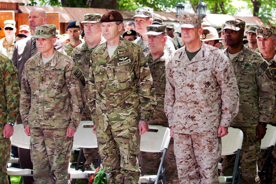 U.S. Marine Corps Gen. John R. Allen, commander of U.S. and international forces in Afghanistan, left, British Lt. Gen. Adrian J. Bradshaw, International Security Assistance Force deputy commander, center, and U.S. Army Maj. Gen. Robert Ashley, International Security Assistance Force deputy chief of staff of intelligence, right, stand at attention during the Memorial Day wreath laying ceremony at the International Security Assistance Force headquarters in Kabul, Afghanistan, May 28, 2012.