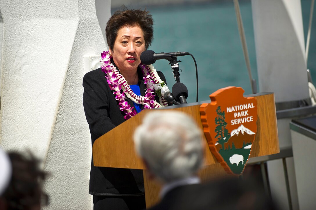 U.S. Rep. Colleen Hanabusa of Hawaii speaks to military and civilian leaders during the USS Arizona Memorial 50th anniversary commemoration ceremony at the USS Arizona Memorial in Honolulu, Hawaii, May 27, 2012.