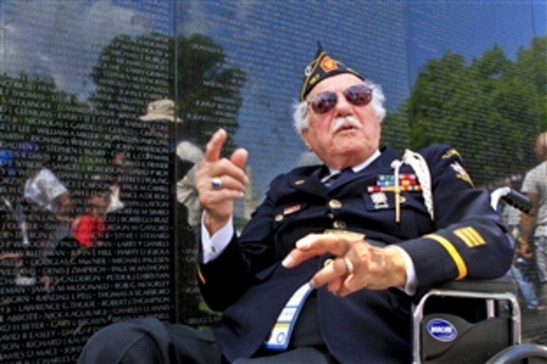 World War II Army veteran Samuel Teolis of Ellwood City, Pa., visits the Vietnam Veterans Memorial and reflects on those who served during the Vietnam War after a Memorial Day ceremony at the wall in Washington, D.C., May 28, 2012. President Barack Obama, Defense Secretary Leon E. Panetta and Army Gen. Martin E. Dempsey, chairman of the Joint Chiefs of Staff, spoke at the ceremony, which also marked the 50th anniversary of the Vietnam War.