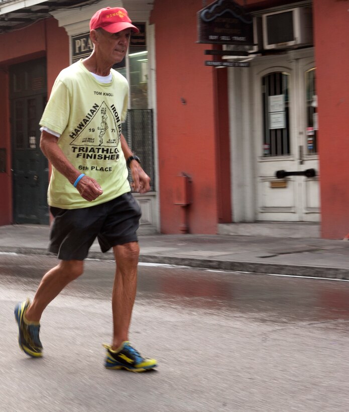 Seventy-nine-year-old retired Master Gunnery Sgt. Tom Knoll runs through the city of New Orleans May 28, 2012 at the beginning of his 1,650 mile run to the Canadian border to raise money for charities.  Knoll began running to make money for charities in the 70s; he has since ran more than 75,000 miles and made more than a million dollars for charities.