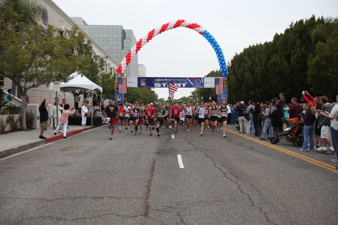 Marines with Battalion Landing Team, 3rd Marines, 5th Battalion, 15th Marine Expeditionary Unit, Camp Pendleton, Calif., are lead runners in the Laguna Hills Memorial Day Half Marathon in Laguna Hills, Calif., May 28.  The Marines were joined by more than 5,000 racers running in the event.  The city of Laguna Hills adopted the battalion in 2007 and has supported it both at home and while deployed.