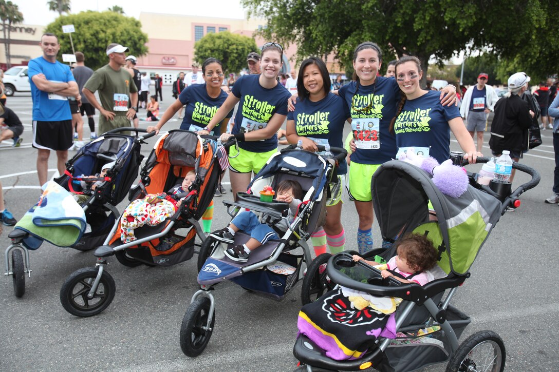 Members of the Stroller Warriors wait at the starting point of the Laguna Hills Memorial Day Half Marathon in Laguna Hills, Calif., May 28.  The women of the club are all wives of active duty Marines and meet weekly to train for different race events in the area.