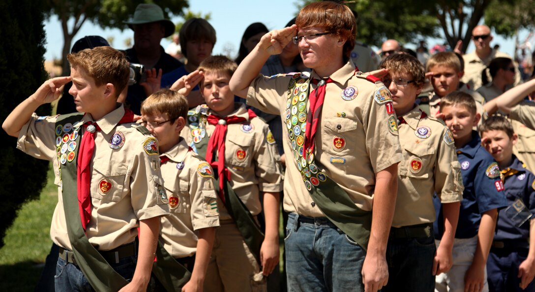 Scouts from Boy Scout Pack 77 salute the American flag during a Memorial Day ceremony at Joushua Tree Memorial Park May 28, 2012. (Official USMC photo by Lance Cpl. Lauren A. Kurkimilis)