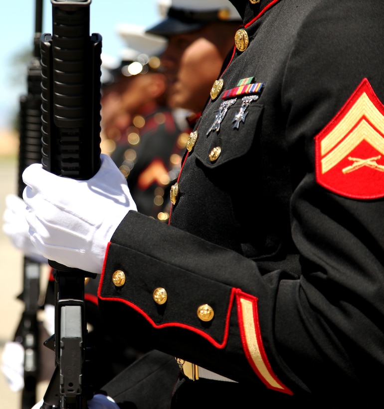 A firing detail of seven Marines shot three volleys each, performing a 21-gun salute during a Memorial Day ceremony held at Joshua Tree Memorial Park May 28, 2012. The 21 rounds are fired in honor of fallen service members, who gave their lives in the line of duty.  (Official USMC photo by Lance Cpl. Lauren A. Kurkimilis)