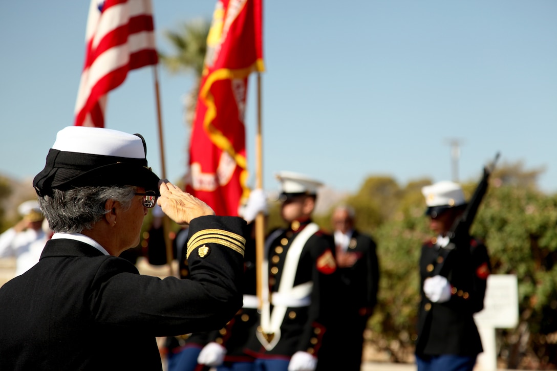 Retired Navy Lt. Cmdr. Mary Kay Sherry salutes the colors as they pass during a Memorial Day Ceremony at Twentynine Palms Cemetery May 28, 2012. (Official USMC photo by Lance Cpl. Lauren A. Kurkimilis)