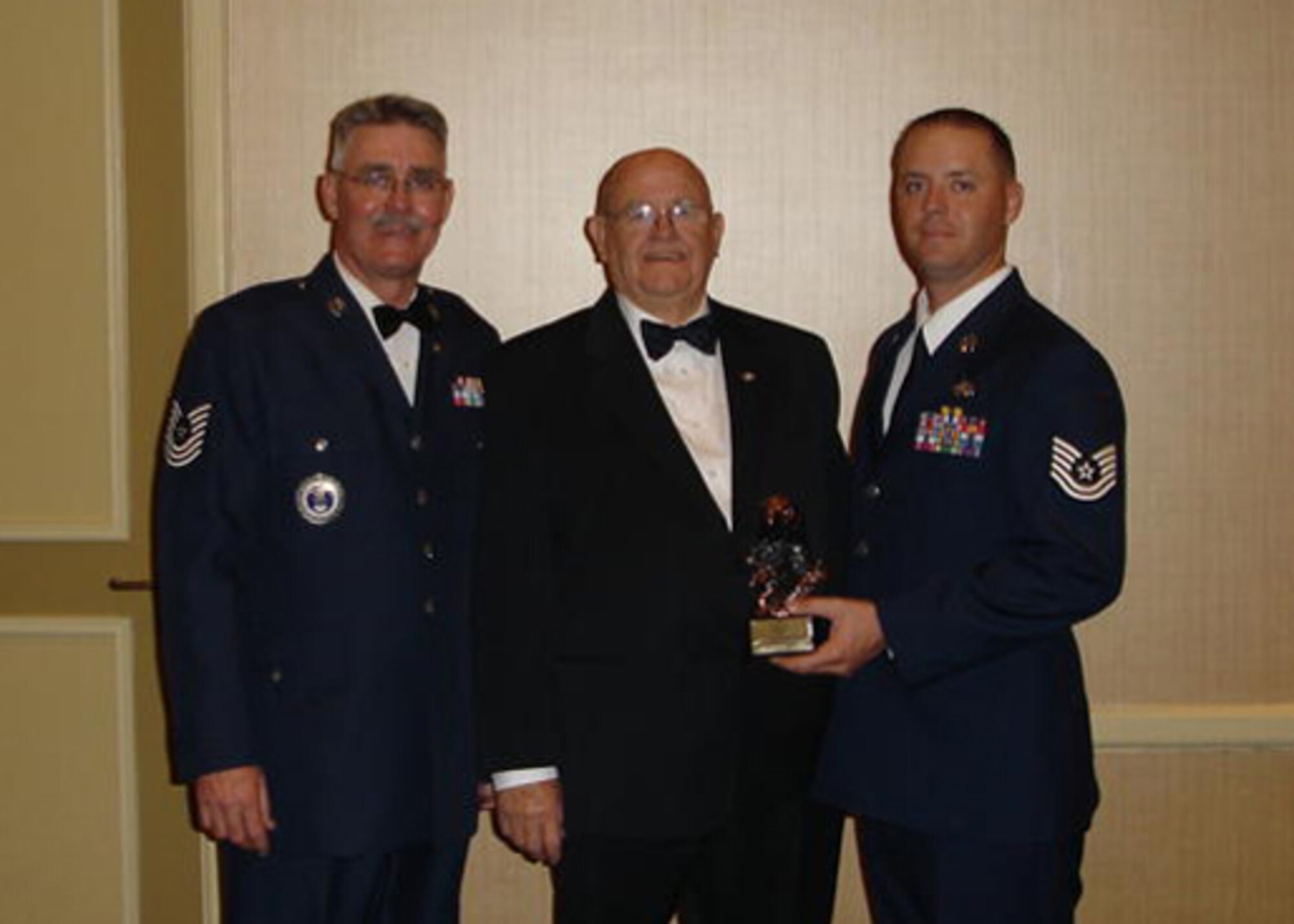 Three generations of Willson's celebrate the youngest's graduation from the NCO Academy. Together, they have served more than 60 continuous years in the United States Air Force. Tech. Sgt. Derrell Willson III (Far right), 412th Aircraft Maintenance Squadron, was notified that he would achieve his long-term goal August 1, when he will become the third Master Sgt. Derrell Clifton Willson. (Courtesy Photo) 