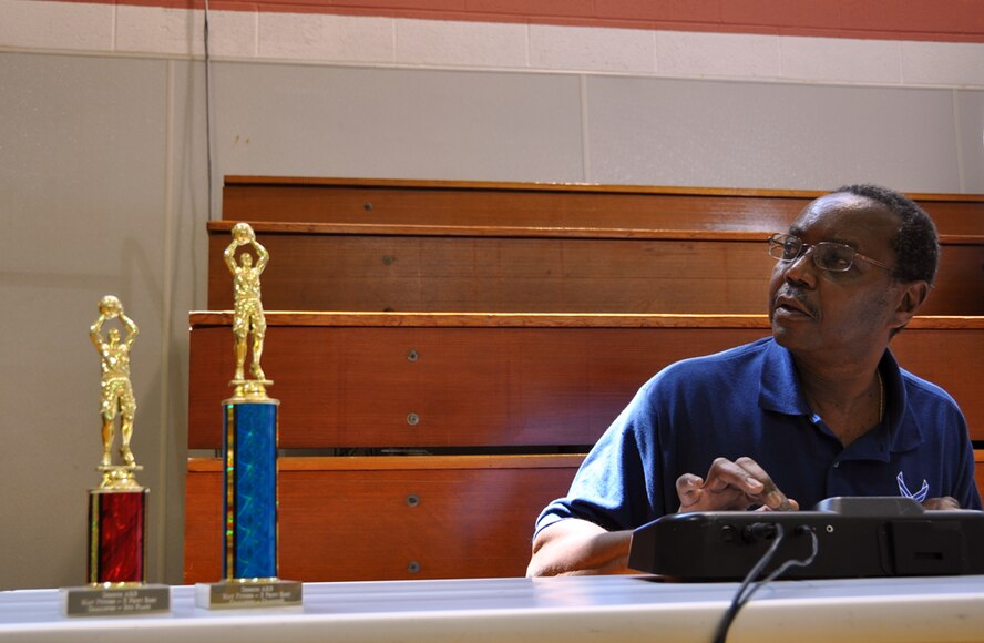 Larry Dudley, Base Fitness Center staff member, acted as both time and score keeper during the Dobbins ARB three-point contest on May 17. The contest was coordinated by the Dobbins ARB fitness center as part of May Fitness Month. (U.S. Air Force photo/Senior Airman Elizabeth Gaston)