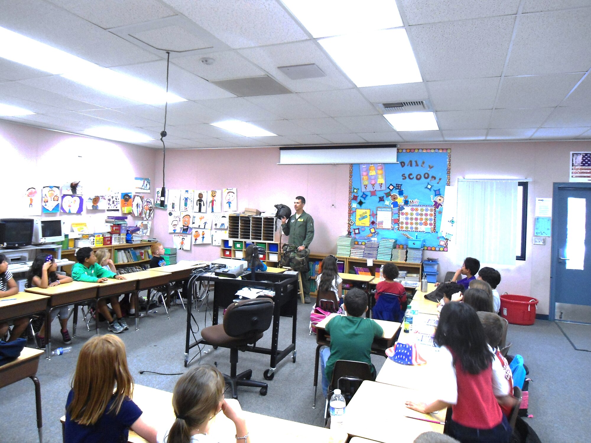 Lt. Col. Jeffrey Mabry, Global Vigilance Combined Test Force director of operations, visited Rancho Vista Elementary School in Palmdale, May 25, along with 20 other military members and veterans for the school's Memorial Day commemoration.  Mabry showed children what different helmets are used for different types of aircraft. (Courtesy photo)
