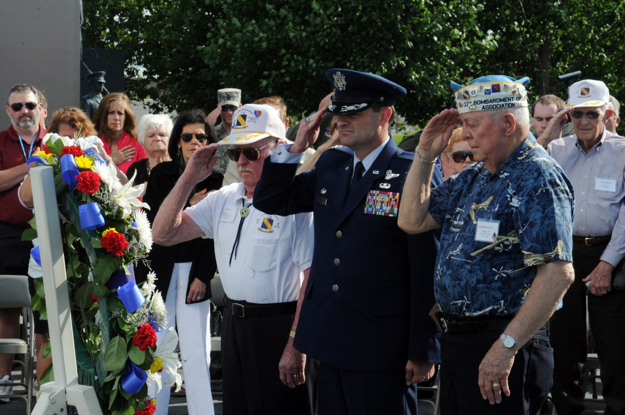 Col. Ken Rizer, 11th Wing/Joint Base Andrews Commander along with Bud Jung (left) and Neil Siebenbruner (Right) take part in a wreath laying ceremony at the Air Force Memorial, May 17. The ceremony was held to pay tribute the members of the 11th Bombardment Group that lost their lives in the Pacific during World War II. (U.S. Air Force photo/Airman 1st Class Aaron Stout)