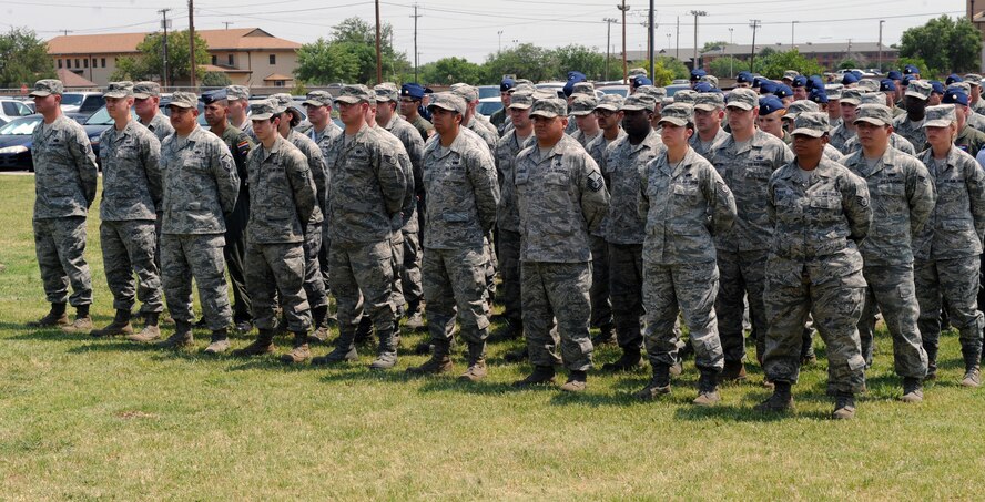 Airmen from the 317th Airlift Group stand at parade rest during a Memorial Day ceremony May 24, 2012, at Dyess Air Force Base, Texas. Memorial Day is a day of remembering the men and women who died while serving in the United States Armed Forces. Formerly known as Decoration Day, it originated after the American Civil War to commemorate the Union soldiers who died in the Civil War. By the 20th century Memorial Day had been extended to honor all Americans who have died in all wars. (U.S. Air Force photo by Airman 1st Class Charles V. Rivezzo/ Released)
