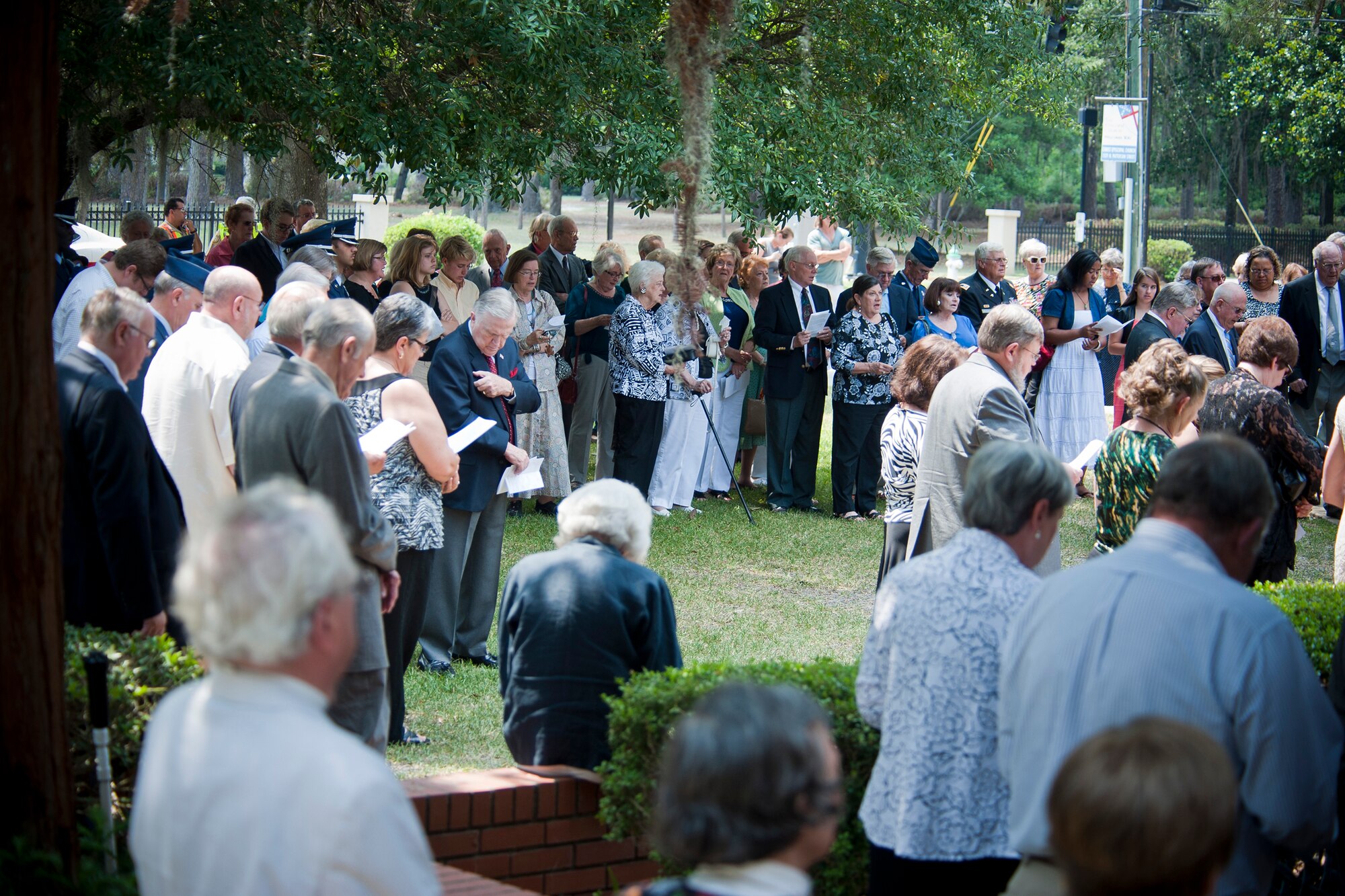 Friends and family of retired U.S. Air Force Lt. Col. Donald Bryan, along with members of the Moody Air Force Base and South Georgia community, pay respects during a memorial service in honor of Bryan May 26, 2012, at Christ Episcopal Church in Valdosta, Ga. Bryan was a double ace pilot officially credited with 13.3 downed enemy aircraft, including five in one day. (U.S. Air Force photo by Staff Sgt. Jamal D. Sutter/Released) 