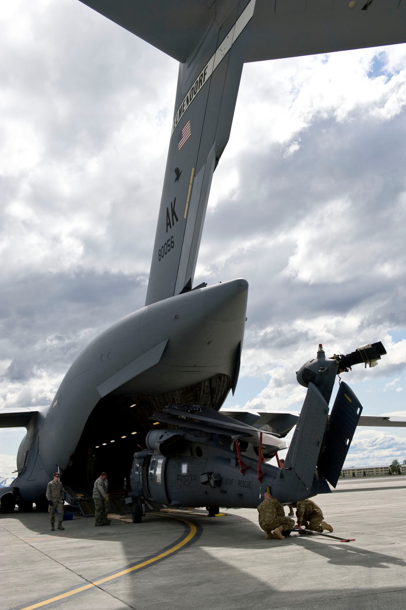 JOINT BASE ELMENDORF-RICHARDSON, Alaska - Members of the Alaska Air National Guard's 176th Wing load an HH-60 "Pave Hawk" search and rescue helicopter onto a C-17 "Globemaster III" for a 120-day deployment to Afghanistan May 28, 2012. The helicopter is a part of a package of equipment and crew that is deploying in support of Operation Enduring Freedom. (National Guard photo by Master Sgt. Shannon Oleson)