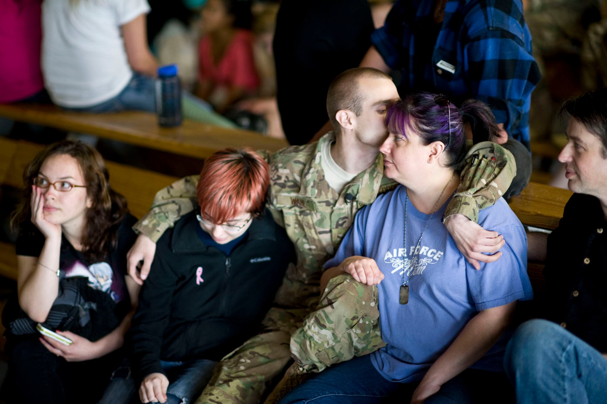 JOINT BASE ELMENDORF-RICHARDSON, Alaska - Airman 1st Class Steven Wahl, a helicopter crew chief with the Alaska Air National Guard's 176th Aircraft Maintenance Squadron, kisses his mom, Kim, and wraps his arm around his sister, Karissa, as he prepares to leave for Afghanistan May 28, 2012. Wahl is flanked by his father, Nick, and his cousin, Tiffany Stroman. More than 180 members of the Alaska Air National Guard's 176th Wing are deploying for about 120 days in support of Operation Enduring Freedom. (National Guard photo by Master Sgt. Shannon Oleson)