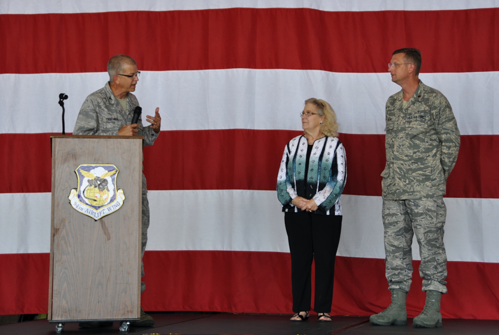 (Left) Col. Tim Tarchick, 94th Airlift Wing commander, and Chaplain (Maj.) Doug Collins present Carol Pope, Dobbins Chapel organist, with a certificate honoring over 40 years of dedicated service to the Dobbins community. (U.S. Air Force photo/Senior Airman Elizabeth Gaston)