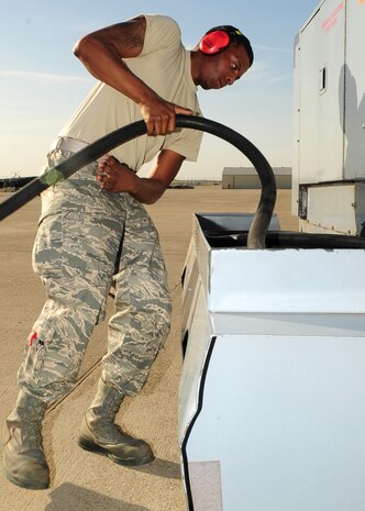 Airman 1st Class Donell Williams, 9th Aircraft Maintenance Squadron RQ-4 Global Hawk avionics apprentice, wraps the cord for a DC generator on the flight line at Beale Air Force Base, Calif., May 8, 2012. Donell used to generator start an RQ-4 in preparation for a flight. (U.S. Air Force photo by Senior Airman Shawn Nickel)
