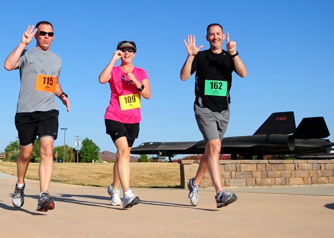 Airmen from the 306th Intelligence Squadron represent their unit during the Beale Air Force Base Half Marathon May 24, 2012 at Beale Air Force Base, Calif. More than 160 Airmen participated in the 13.1 mile run around the base. (U.S. Air Force photo by Senior Airman Shawn Nickel)