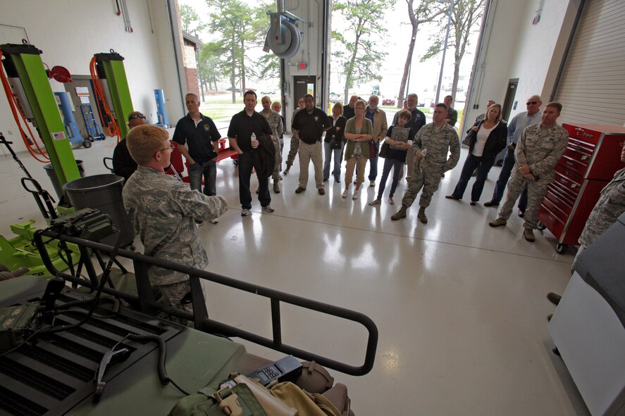 Air liaison officer 2nd Lt. Keith A. Giamberardino, back to camera, discusses the equipment used by the 227th Air Support Operations Squadron during a tour by employers of traditional 177th Fighter Wing Guardsmen May 23, 2012.  The New Jersey Committee for Employer Support of the Guard and Reserve (ESGR) and the 177th Fighter Wing, New Jersey Air National Guard, held a 177th Employer Appreciation Day where traditional Guardsmen brought their employers to the Wing. After a briefing about the Wing's mission by Wing commander Col. Kerry M. Gentry, the employers toured the base, witnessed a ground scramble of F-16 Fighting Falcons and flew in a UH-60 Black Hawk helicopter assigned to the 1-150th Assault Helicopter Battalion, New Jersey Army National Guard.  After the employers returned, they signed ESGR Statements of Support, which enlists the support of employers in the development of policies and practices that support and encourage employee participation in the Guard and Reserve. U.S. Air Force photo by Master Sgt. Mark C. Olsen