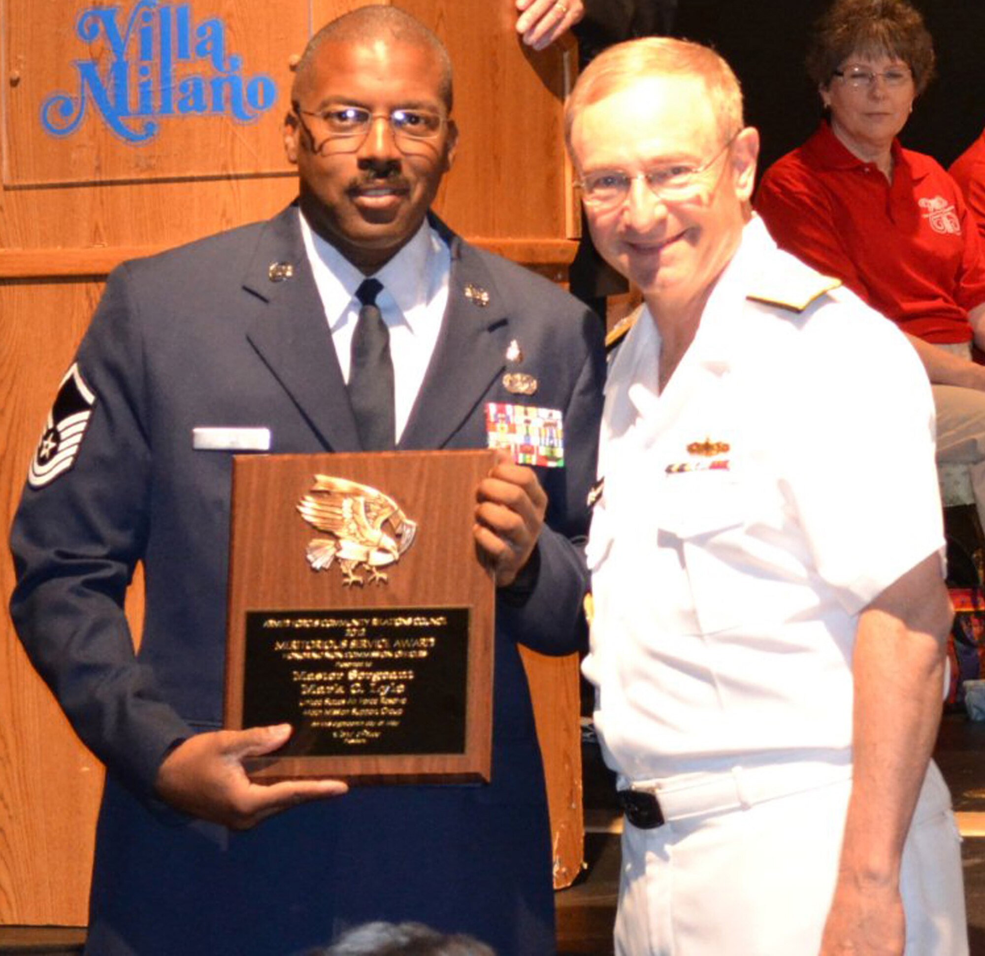 WRIGHT-PATTERSON AIR FORCE BASE, Ohio - Master Sgt. Mark Lyle, a member of the 445th Mission Support Group and Superintendent of the Wright-Patterson Air Force Base Honor Guard program, is presented with the 2012 Outstanding NCO of the Year by Vice Admiral James P. Wisecup, Naval Inspector of the United States Navy. Lyle was selected for the award by the Armed Forces Community Relations Council in conjunction with the USO of Central and Southern Ohio and MilVets. (Courtesy photo)