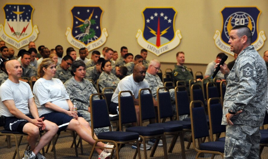 Chief Master Sgt. Larry Malcom, 2nd Bomb Wing command chief, gives Airmen his cell phone number at a 2 BW All Call on Barksdale Air Force Base, La., May 24. Malcom encouraged Airmen to have a plan before celebrating over the long weekend and also encouraged them to call him if all of their plans failed to prevent them from driving while under the influence. (U.S. Air Force photo/Airman 1st Class Micaiah Anthony)(RELEASED)