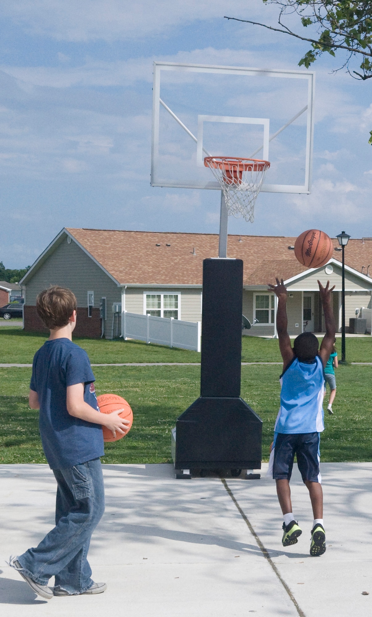 Children play outside May 24, 2012, at the Youth Center on Dover Air Force Base, Del. The Youth Center offers many different programs and camps during the summer months to keep children engaged and active while out of school. (U.S. Air Force photo by Senior Airman Matthew Hubby)
