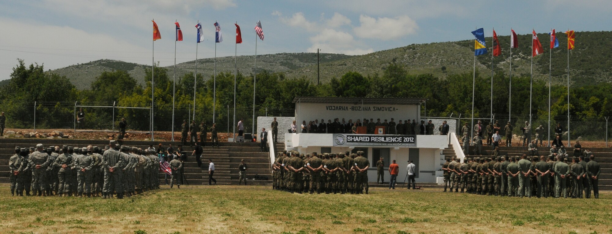 Participants of Shared Resilience 2012 stand in formation during the exercise’s opening ceremony at Capljina, Bosnia and Herzegovina, May 28, 2012. The goals of the exercise are to strengthen interoperability; facilitate training in crisis response and disaster management; and validate the readiness of deployable military medical and humanitarian assistance teams. (U.S. Air Force photo/Staff Sgt. Tabitha Lee)