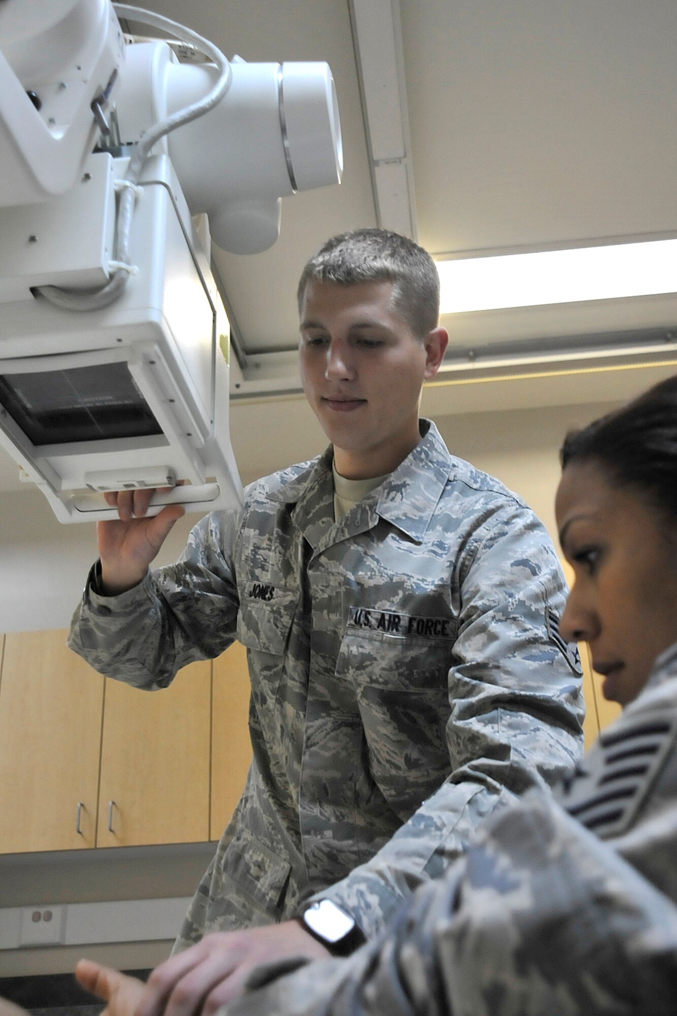 Senior Airman David Jones, 21st Medical Support Squadron radiology technician, developed two innovative methods to improve patient care here, including a new screening method which has eliminated patient paperwork, as well as a new way to access patient information. (U.S. Air Force photo/Dennis Howk)