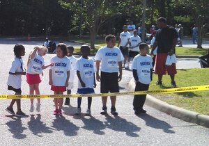 Children wait at the starting line to begin the 7-8 year-old's portion of the 2012 America's Armed Forces Kids Run at Fort Eustis, Va., May 19, 2012. Children as young as 4 and their families ran in honor of Armed Forces Day, joining thousands of other children across the globe on Army, Air Force, Navy and Marine Corps installations. (Photo courtesy/Caitlin Lavin)