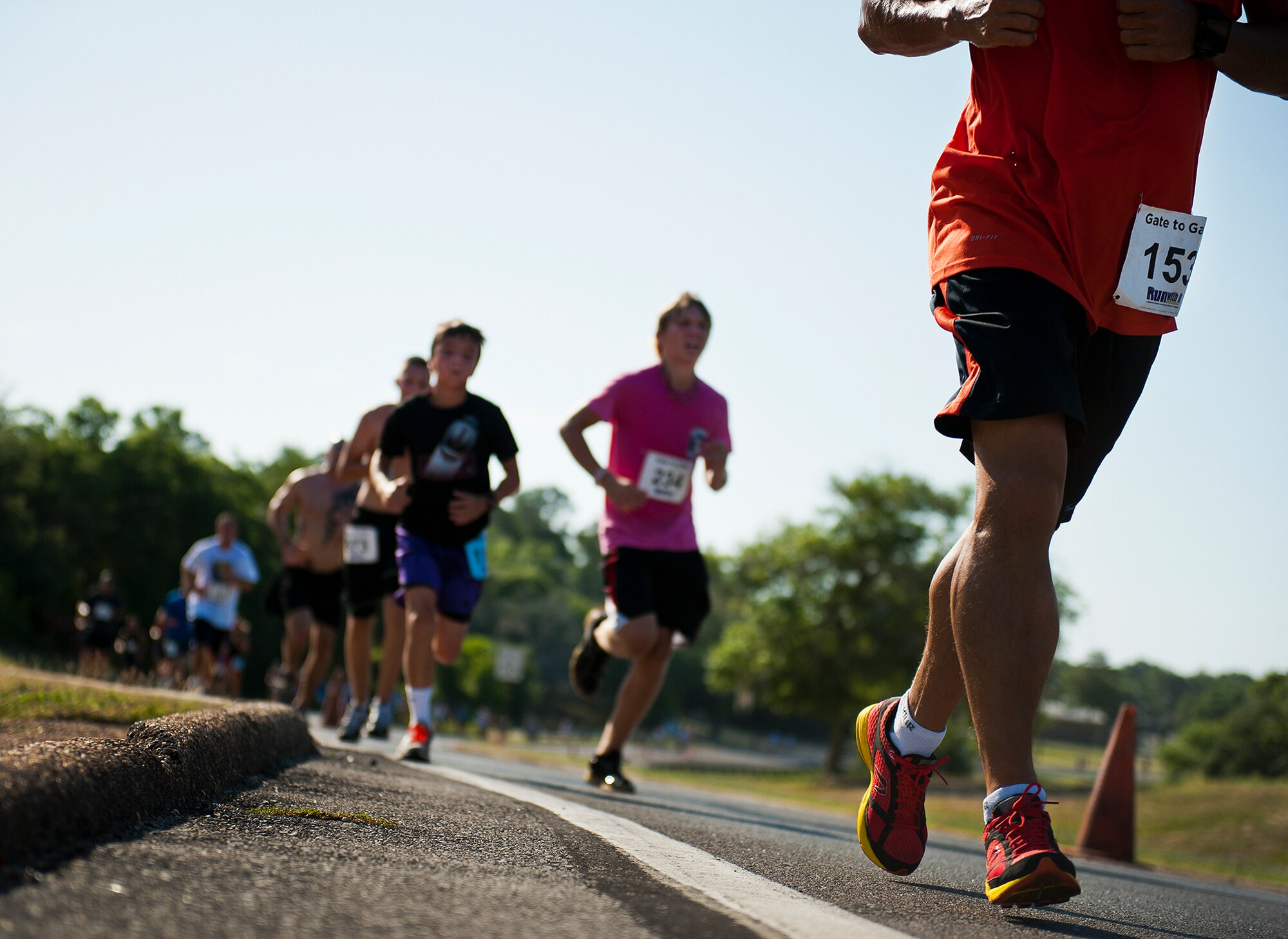Runners stride up the steep hill toward the finish line at the Gate-to-Gate run May 28 at Eglin Air Force Base, Fla.  More than 1,600 people ran in the annual Memorial Day event.  (U.S. Air Force photo/Samuel King Jr.)