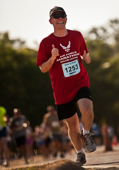 Robert Lamott, of the Air Force Research Lab, climbs the last hill approaching the finish line of the Gate-to-Gate run May 28 at Eglin Air Force Base, Fla.  More than 1,600 people ran in the annual Memorial Day event.  (U.S. Air Force photo/Samuel King Jr.)