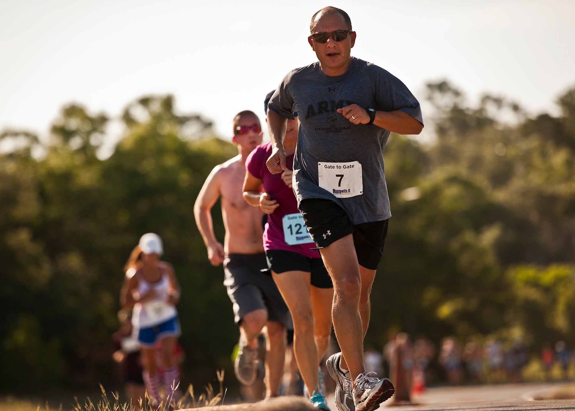 Miguel Howe makes his way up the final hill approaching the finish line of the Gate-to-Gate run May 28 at Eglin Air Force Base, Fla.  More than 1,600 people ran in the annual Memorial Day event.  (U.S. Air Force photo/Samuel King Jr.)