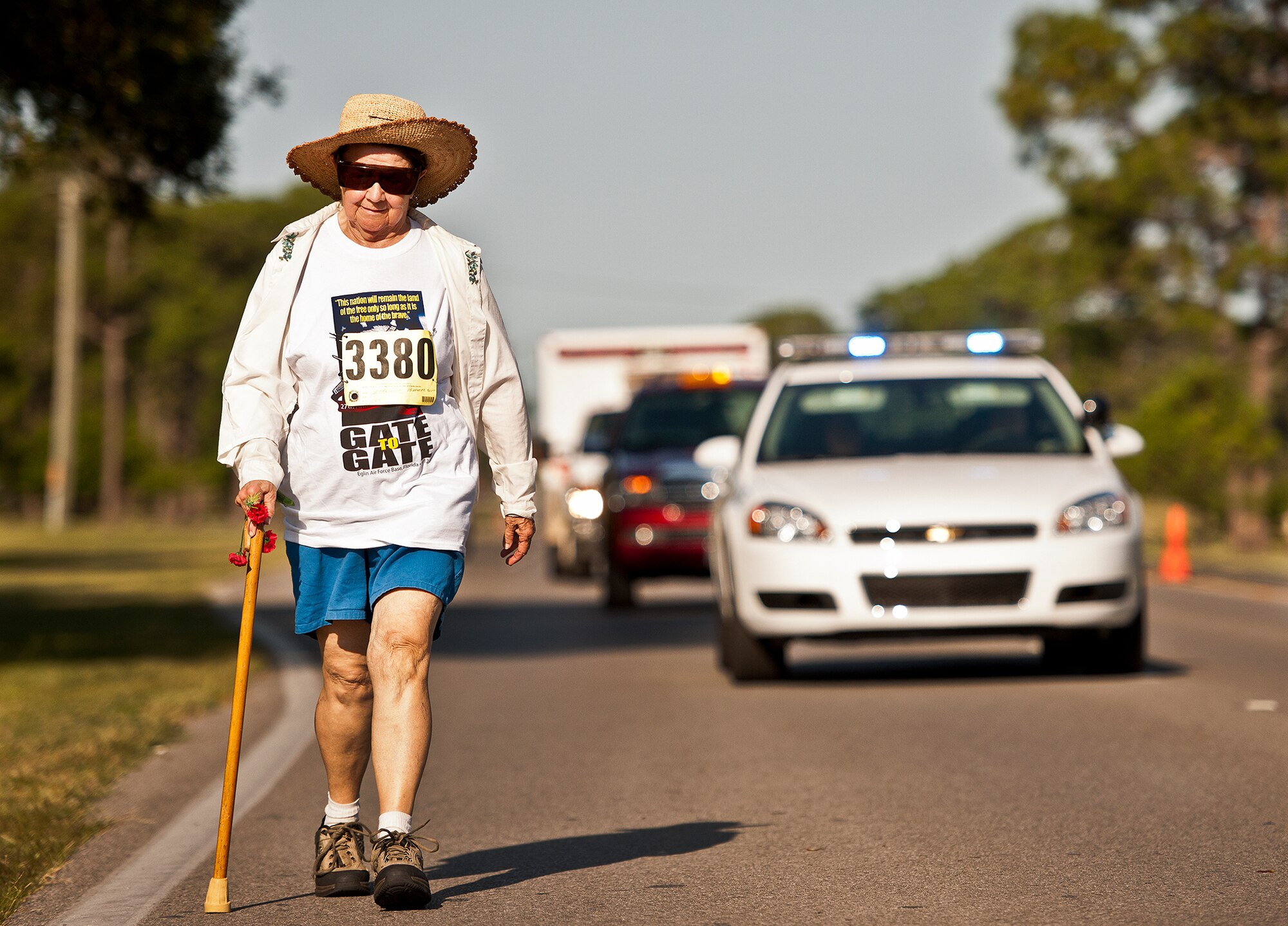 Margaret Bartlett, age 83, walks down Eglin Boulevard during the Gate-to-Gate run May 28 at Eglin Air Force Base, Fla.  More than 1,600 people ran in the annual Memorial Day event.  (U.S. Air Force photo/Samuel King Jr.)